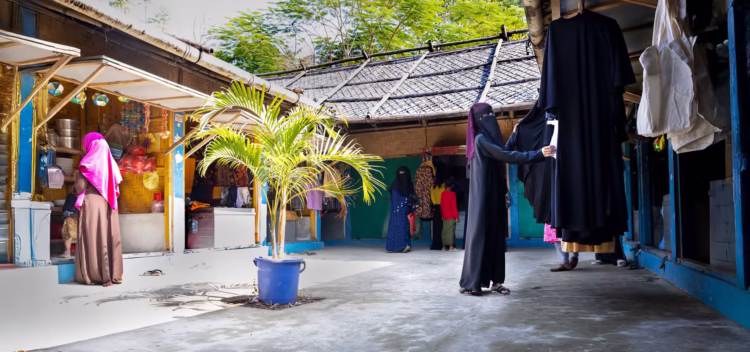 Rohingya women come to shop at the Women’s Market for clothes, cookware, food, groceries, beauty products and beauty parlour services and more, as they consider it a safe space for women in Camp 5. This photo was taken at the Women’s Market in Refugee Camp 5 in Cox’s Bazar, Bangladesh, on 20 November 2024. This is not the woman profiled in the accompanying story. Photo: UN Women/Naimuzzaman Prince