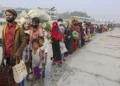 Rohingya refugees headed to Bhasan Char island prepare to board navy vessels from the southeastern port city of Chattogram, Bangladesh on February 15, 2021. © 2021 AP Photo