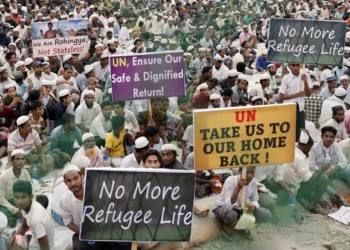 Rohingya refugees hold placards at a Ramadan Solidarity Iftar held in the Cox’s Bazar refugee camps in March 2025, attended by UN Secretary-General António Guterres and Bangladesh's interim leader Muhammad Yunus.