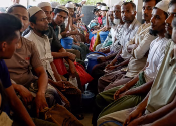 Rohingya refugees wait at the World Food Programme distribution centre to purchase grocery items, at the refugee camp in Cox's Bazar, Bangladesh, March 15, 2025. PHOTO: REUTERS